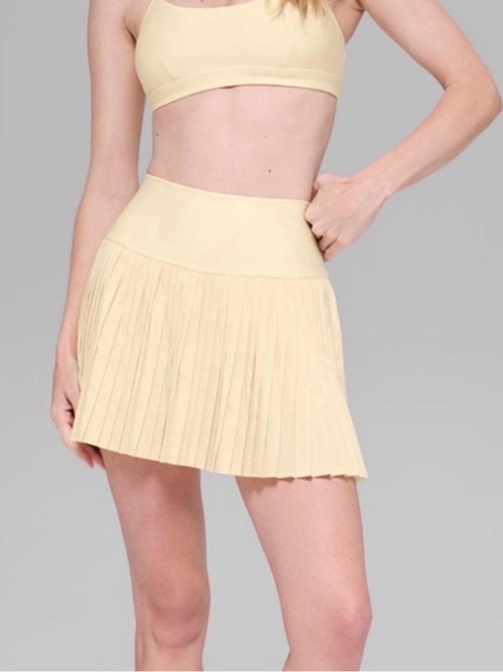 ALO Yoga Pleated Mini Skirt in Pale Yellow size L